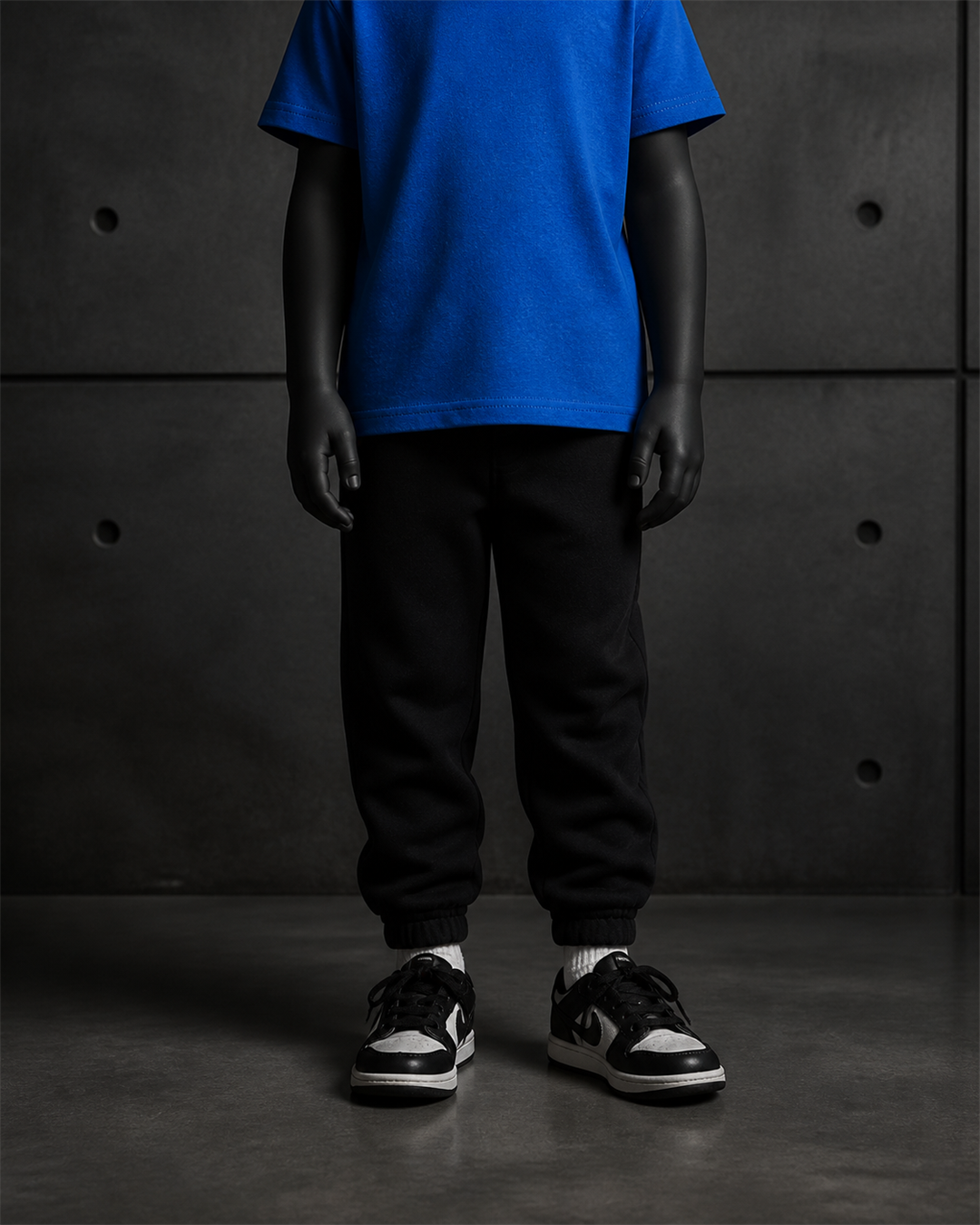Kids Relax Track Pants 3040 blank product on dark industrial concrete background