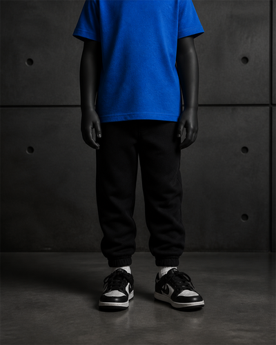 Kids Relax Track Pants 3040 blank product on dark industrial concrete background