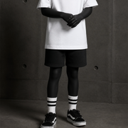 Kids Relax Track Shorts 3042 blank product on dark industrial concrete background