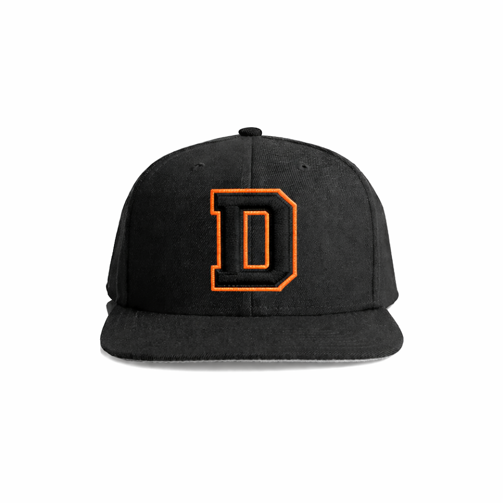 Black snapback cap with a bold orange embroidered letter ’d’ on the front.