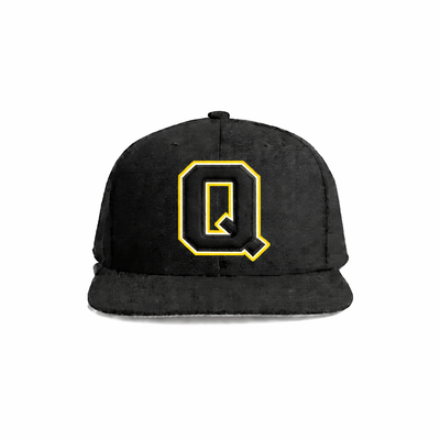 Black velvet snapback cap featuring a bold yellow embroidered letter ’q’ on the front.