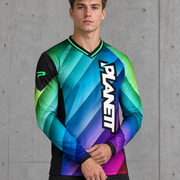 A man wearing a long-sleeve athletic jersey with a vibrant diagonal gradient pattern in green, blue, purple, and pink, featuring the brand name 'PLANET' printed vertically on the front.