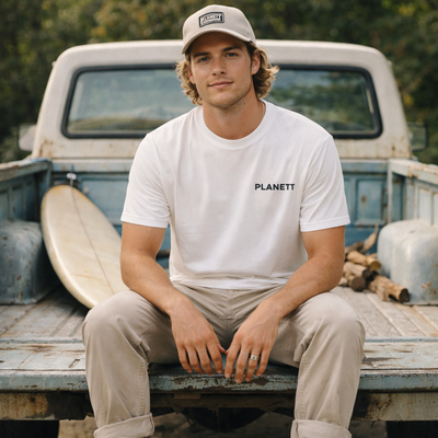White cotton t-shirt with black ’planett’ logo on the chest