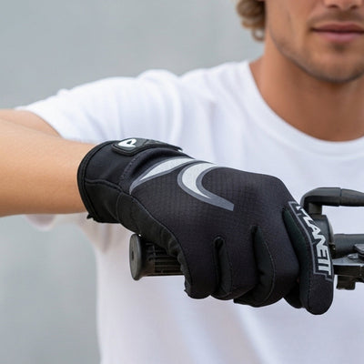 A black sports glove with grey reflective accents.