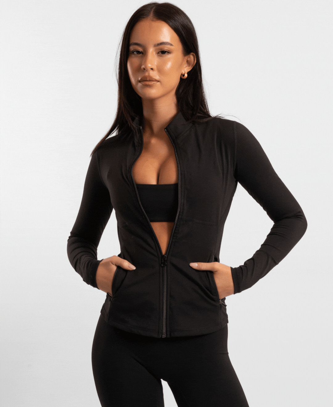 Black zip-up athletic jacket with pockets and a high collar.