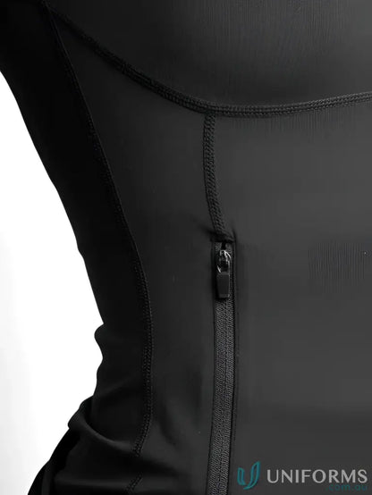 Black zippered uniform vest with elastic waistband and adjustable straps.