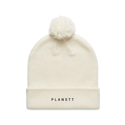 Off-white knit beanie with pompom.