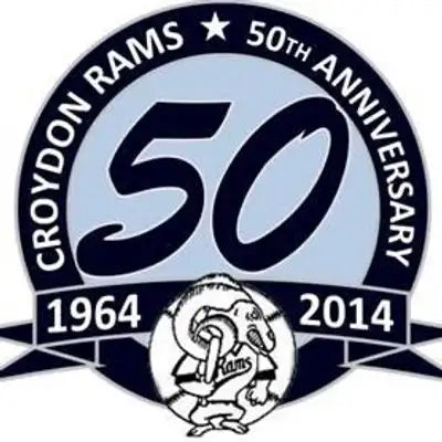 Croydon rams 50th anniversary commemorative pin featuring a navy blue and light gray circular design with the number ’50’’ prominently displayed, encircling the team’s ram mascot in black-and-white.