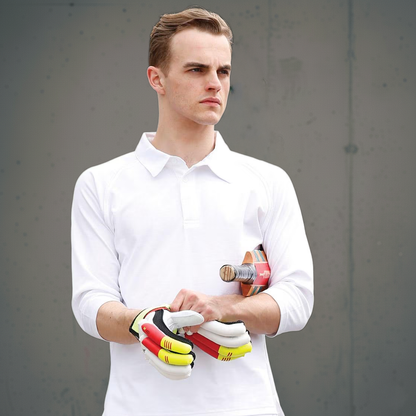 White polo shirt with long sleeves and collar, made of cotton.