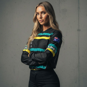Woman in a black, yellow, and blue long-sleeved athletic shirt and black pants.