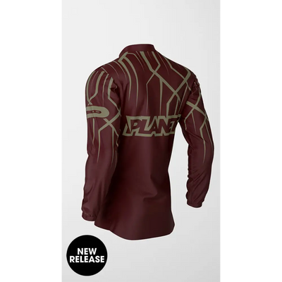 Maroon long-sleeved shirt with abstract design.