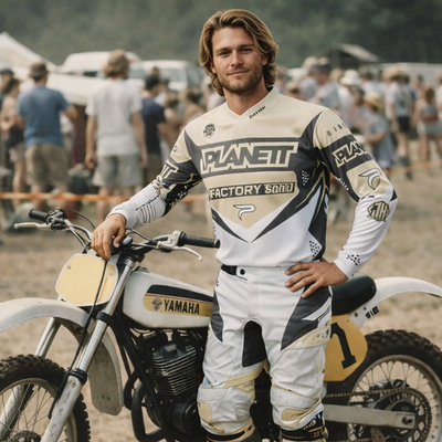 White and beige motocross jersey with black accents, featuring ’planet factory sando’ branding across the chest.