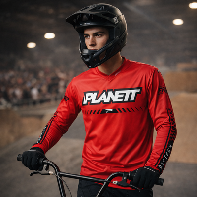 Red long-sleeved mountain bike jersey with black ’planett’ branding and matching sleeve graphics.