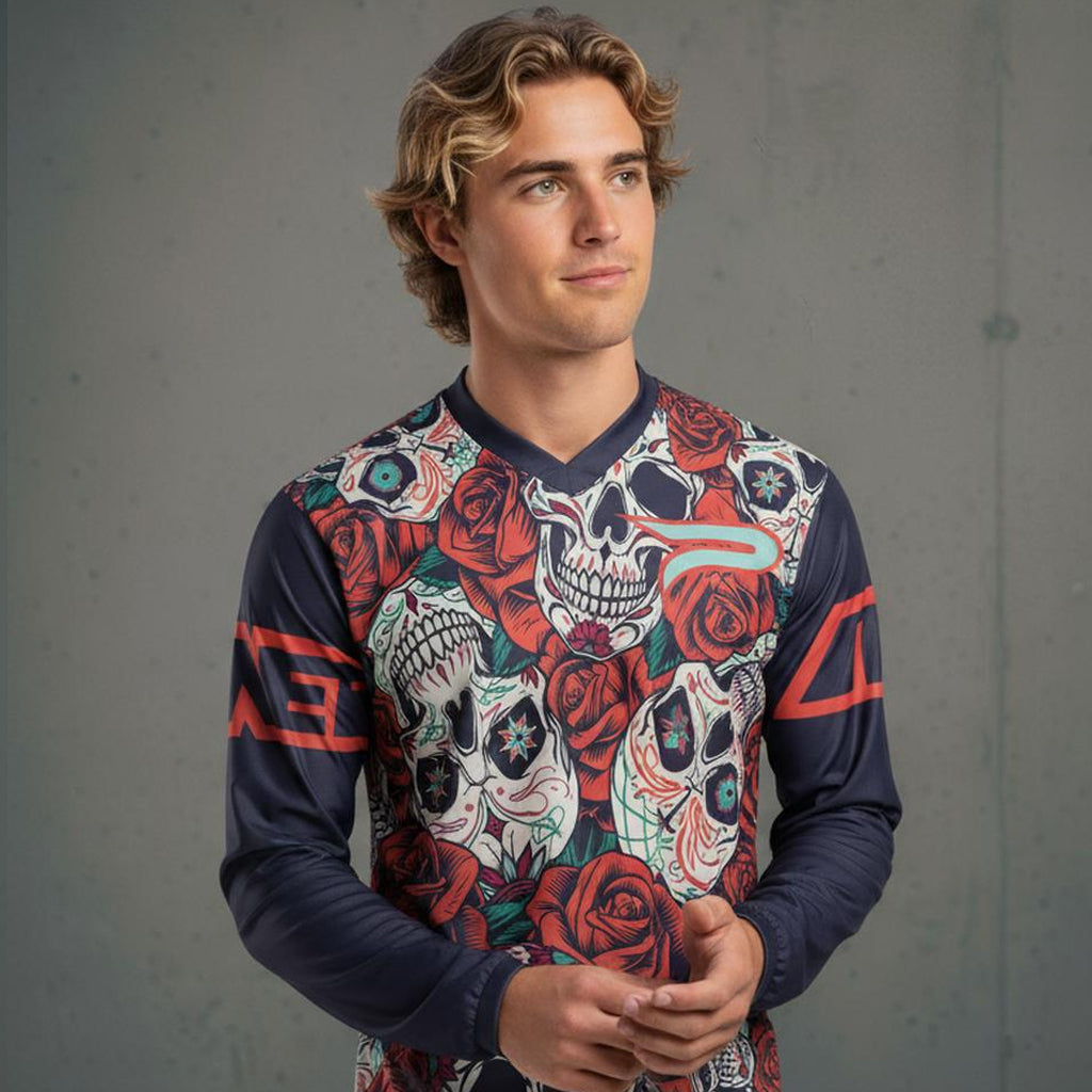 A long-sleeved dark blue shirt with a colorful sugar skull and rose pattern.
