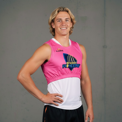 Pink and white sleeveless sports jersey with ’bendigo pioneers’ logo.