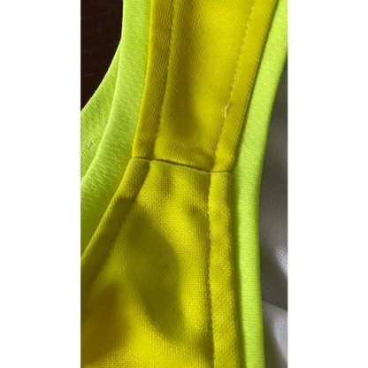 Bright yellow fabric with seams.