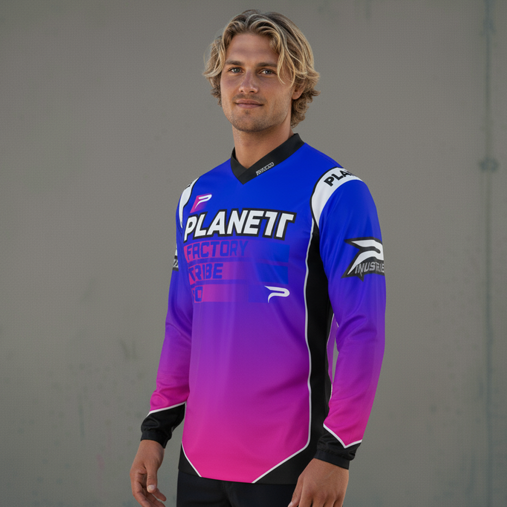 A man modeling a blue and pink gradient long-sleeved athletic jersey.
