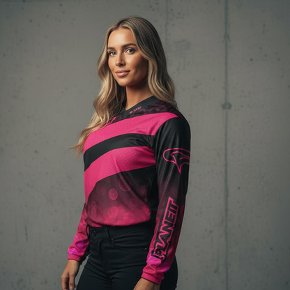 Woman in a black and pink long-sleeved athletic shirt and black pants.