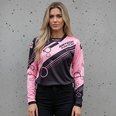 A long-sleeved athletic jersey with a black and pink bubble design.