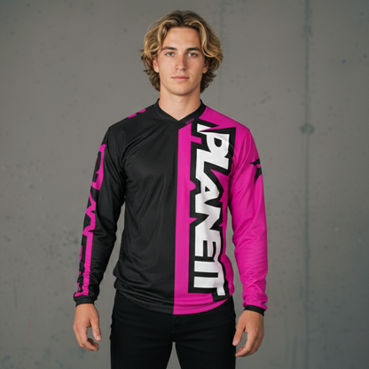 A men’s long-sleeved jersey, split vertically with black on the left and bright pink on the right, featuring white ’PLANET’ text running vertically down the pink side and pink accents on the black sleeve.