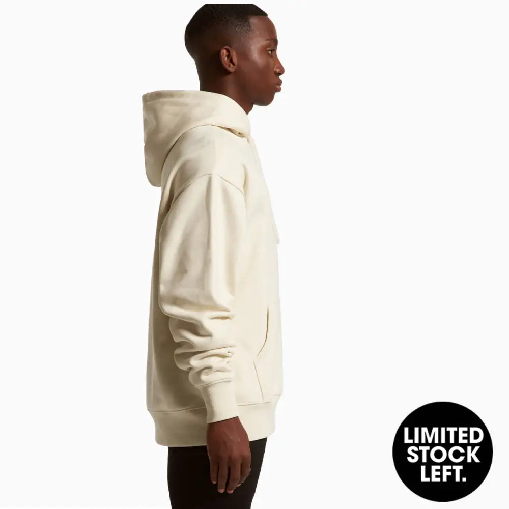 Man wearing a cream-colored hoodie.