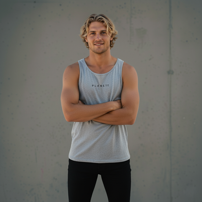 A man in a light grey tank top and black pants.