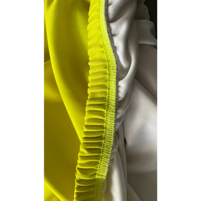 Yellow and white elastic fabric.