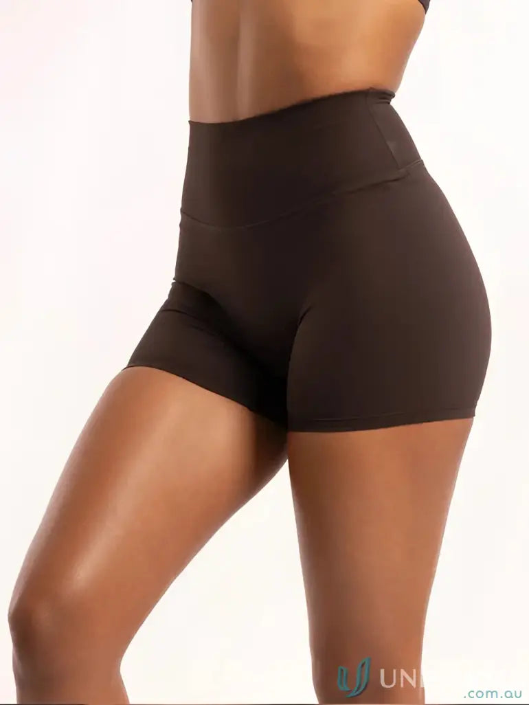 Brown high-waisted shorts with a smooth texture and elastic waistband.