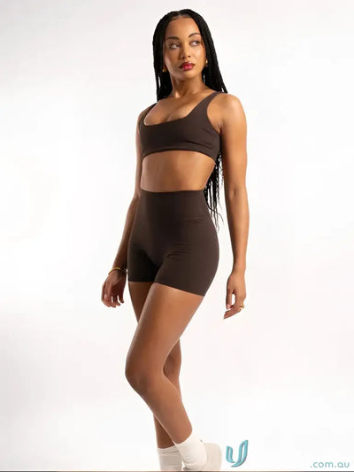 Brown high-waisted shorts with a sleek design and soft material.