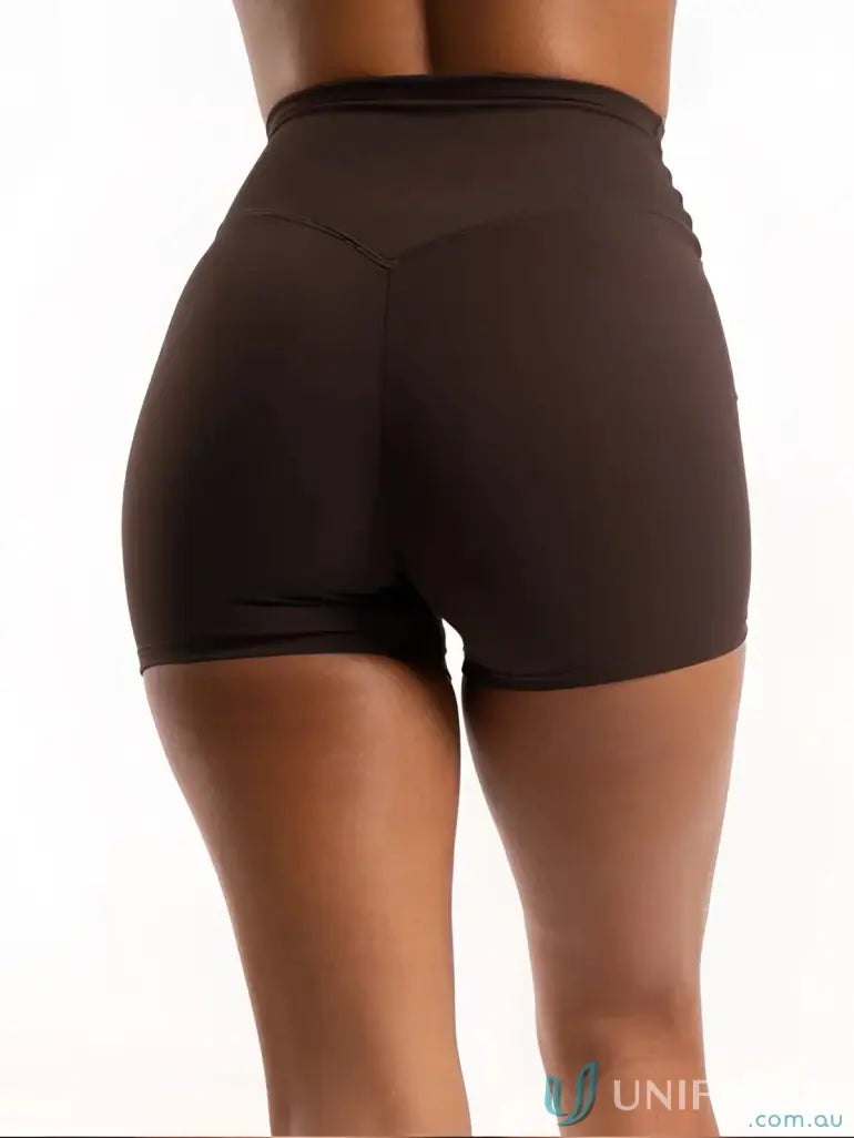Brown high-waisted shorts with a sleek design and elastic waistband.