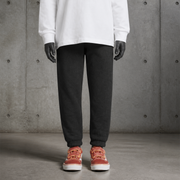 Kids Supply Track Pants 3023 blank product on dark industrial concrete background