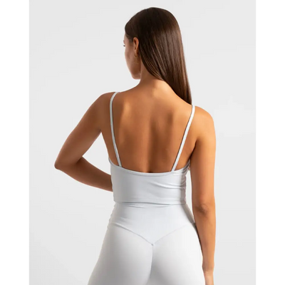 White athletic top and leggings.