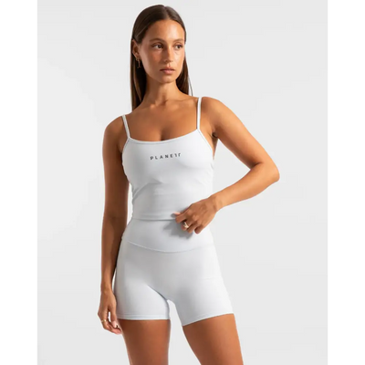 White athletic top and shorts set.