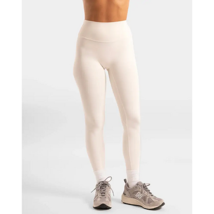 Beige leggings and sneakers.