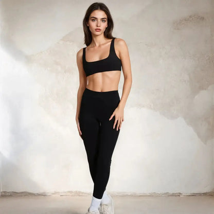 Woman in black athletic wear.