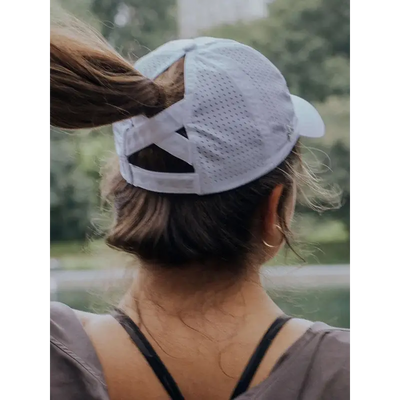 White ponytail baseball cap.