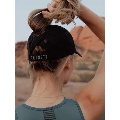 Black ponytail baseball cap.