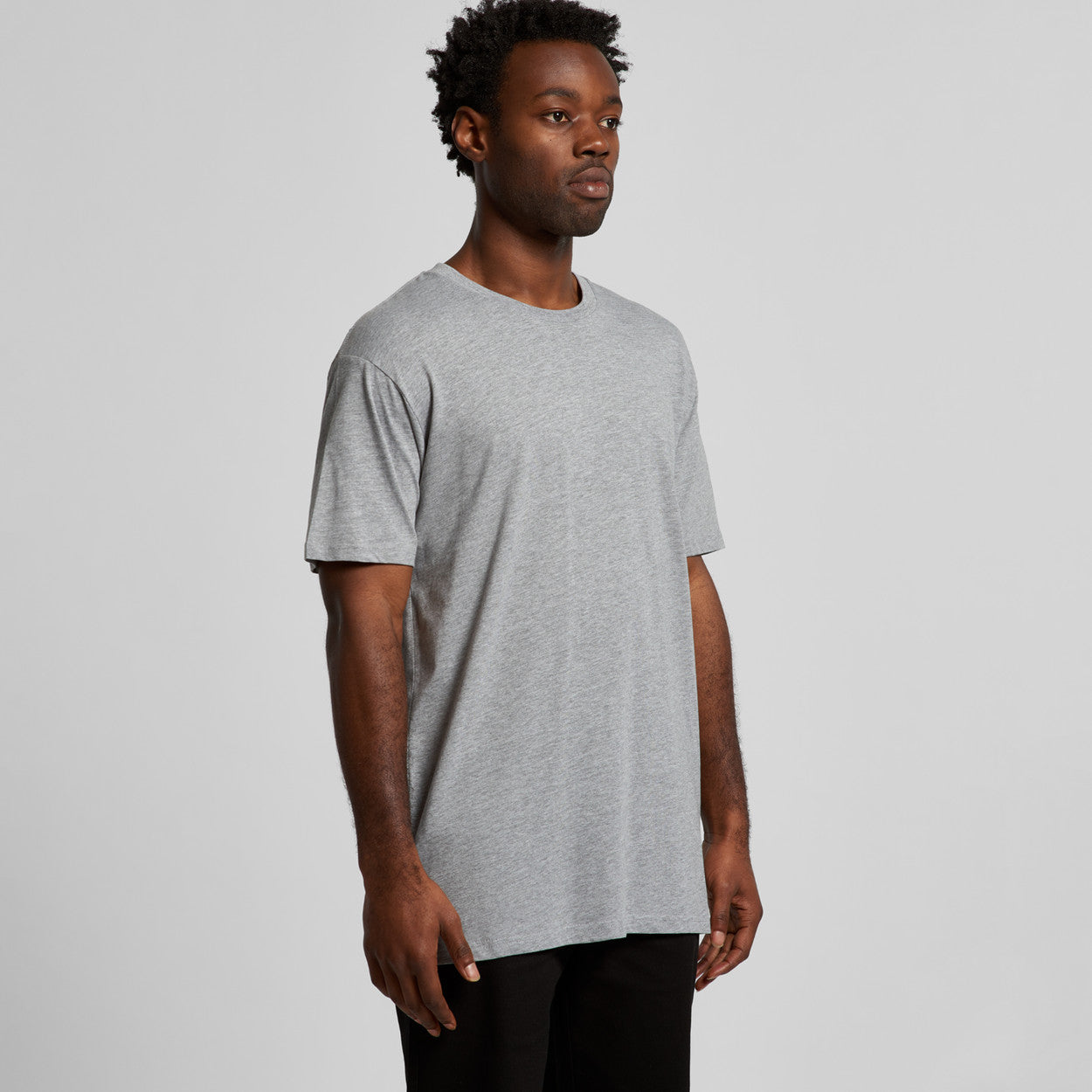 Light gray textured t-shirt with crew neck and short sleeves, possibly made of cotton or polyester blend.