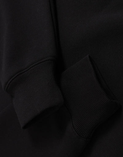 Black sweatshirt sleeve.