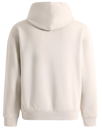 Beige hooded sweatshirt.