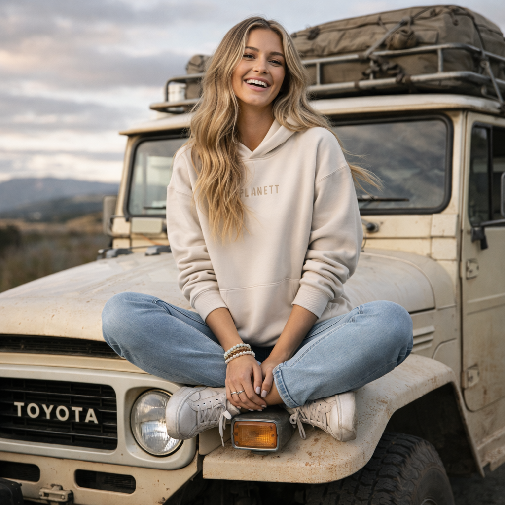 Beige ’planett’ hoodie with a soft, casual fit and subtle gold lettering across the chest.