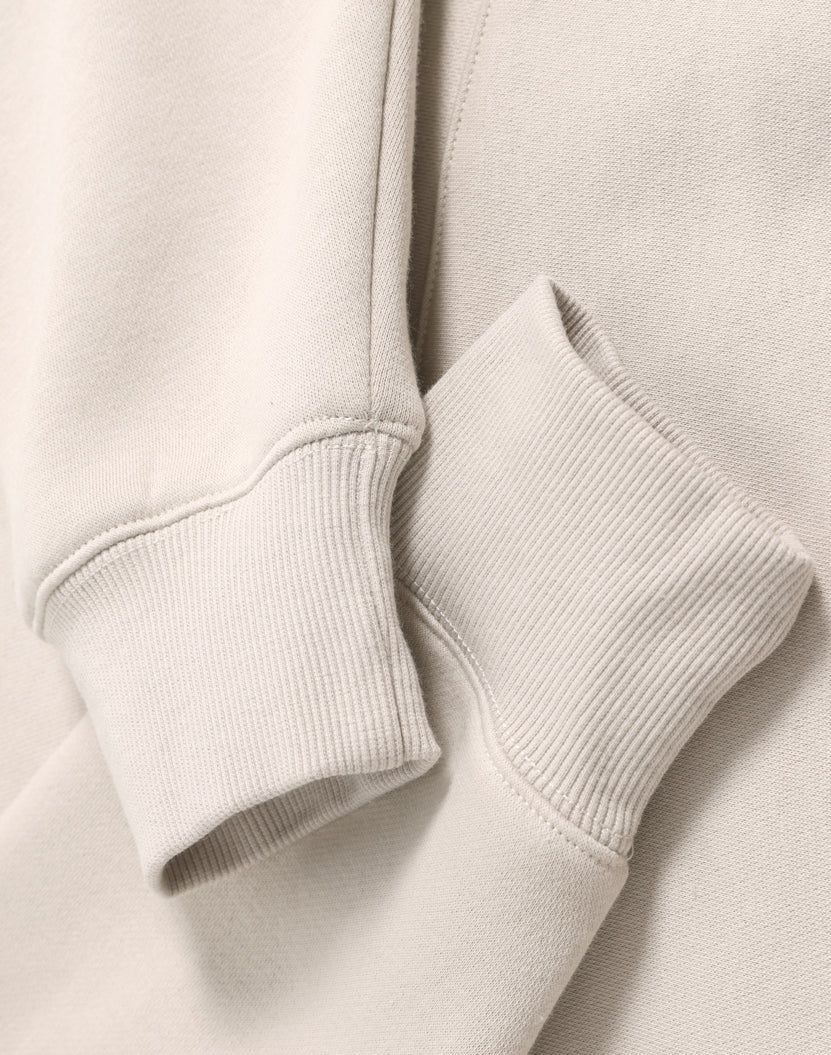 Beige sweatshirt cuffs.