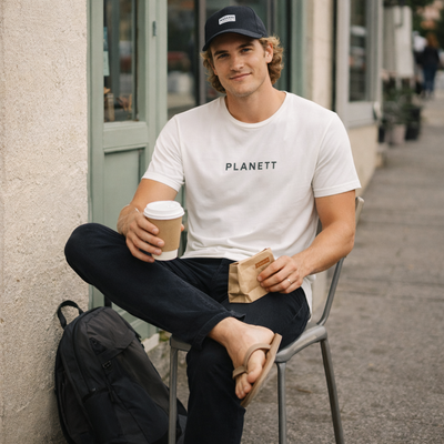 White cotton t-shirt with black ’planett’ text across the chest