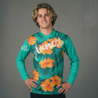 A long-sleeved jersey with a tropical floral and leaf pattern.