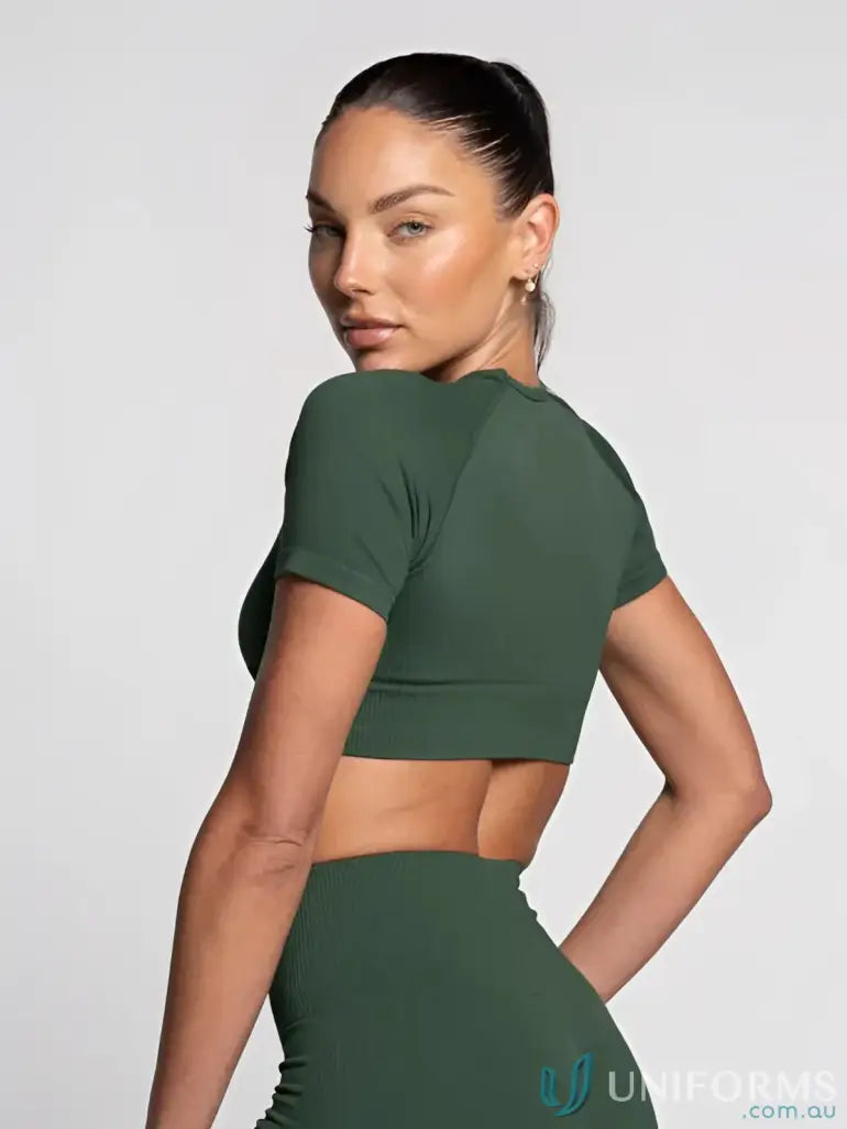 Olive green crop top with short sleeves and a sleek design.