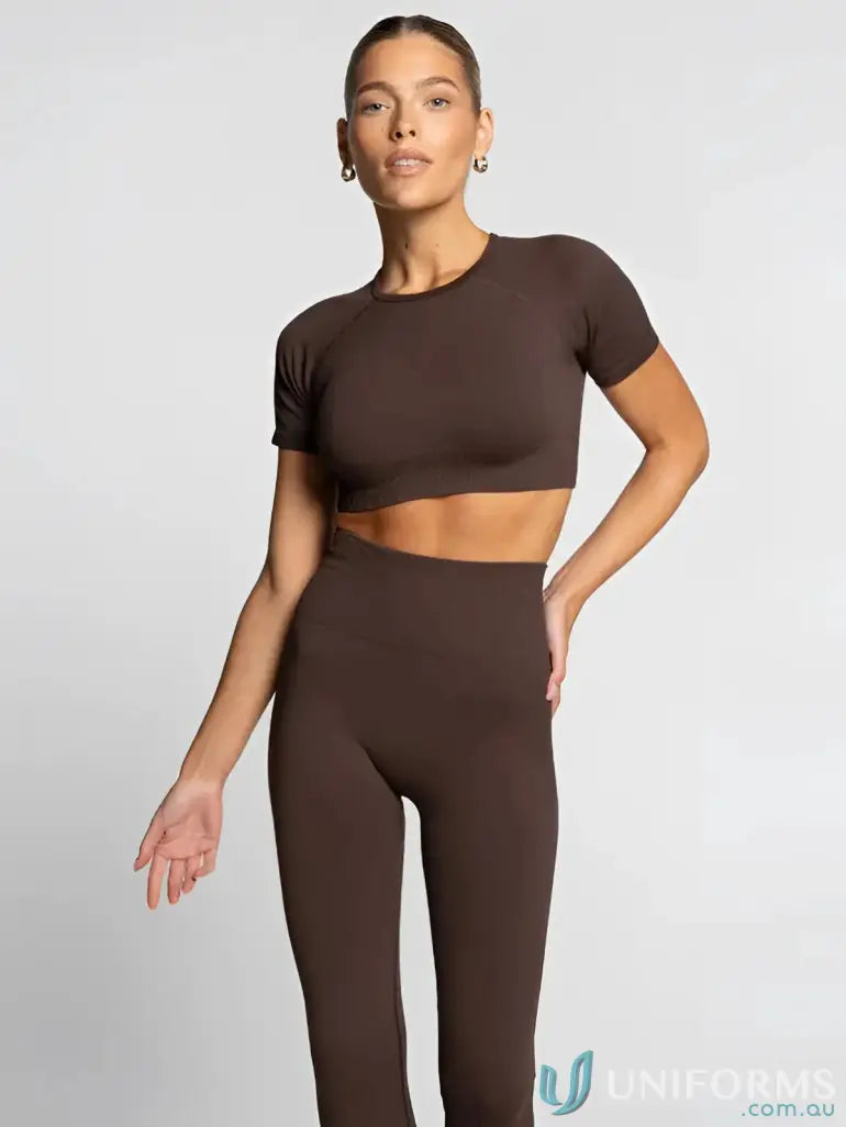 Brown leggings with a ribbed texture and elastic waistband, likely made of spandex or cotton blend.