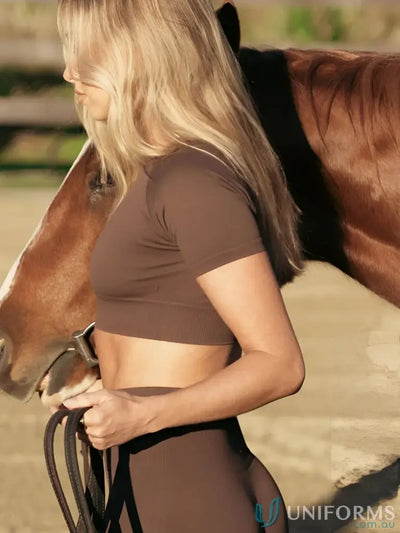 Brown short-sleeved crop top with mesh paneling and elastic waistband.
