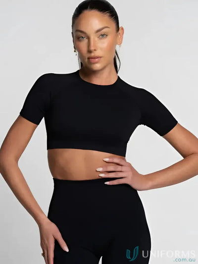 Black cropped athletic top with short sleeves and ribbed neckline.