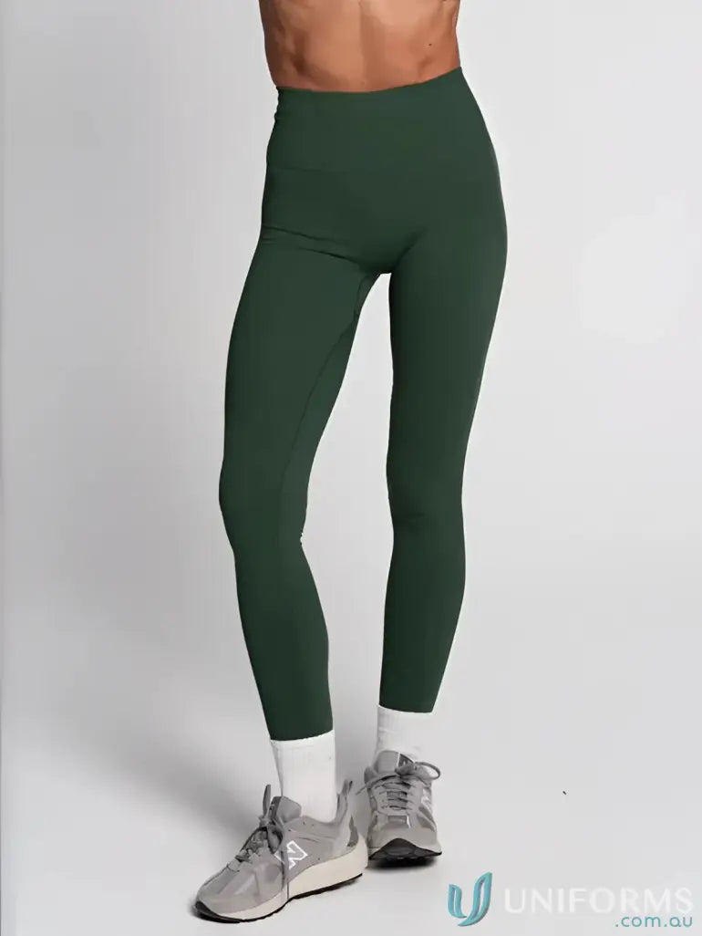 Dark green leggings with high waistband and white socks