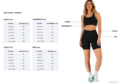 Black high-waisted athletic shorts with white socks and sneakers.